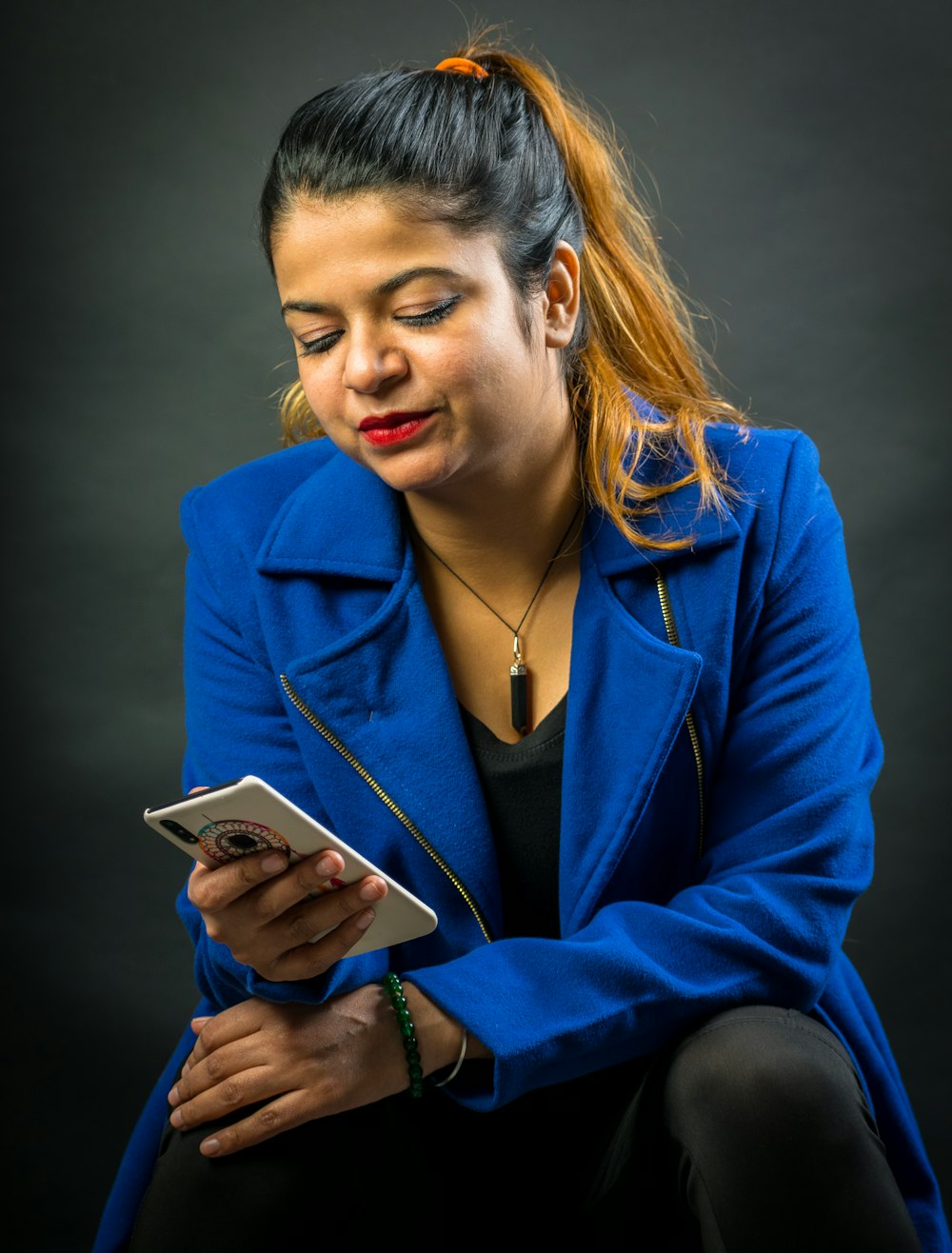 woman wears blue coat