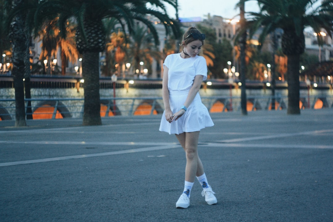 woman wearing whute shirt and white skirt