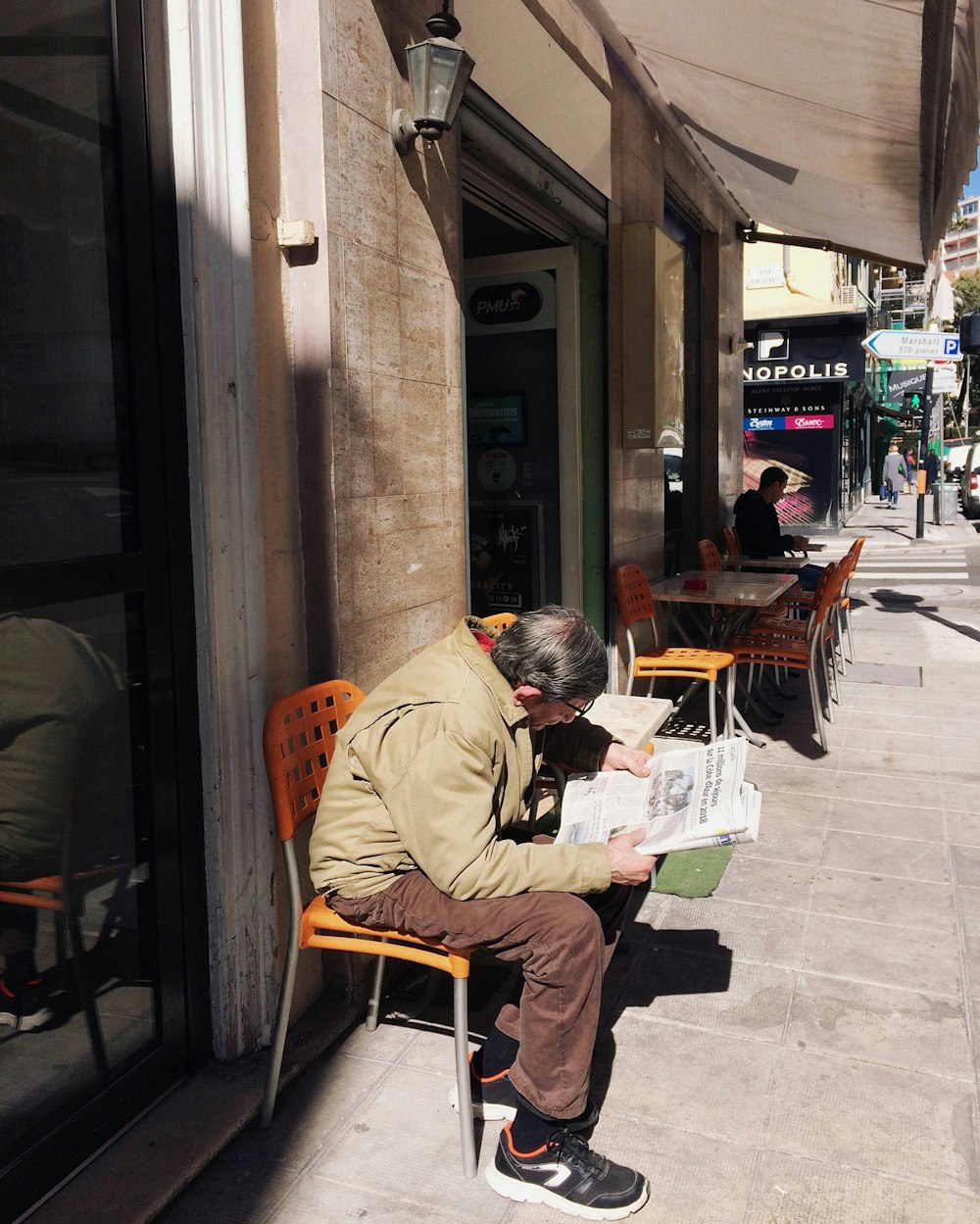 man reading newspaper