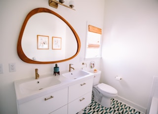 white wooden cabinet sink