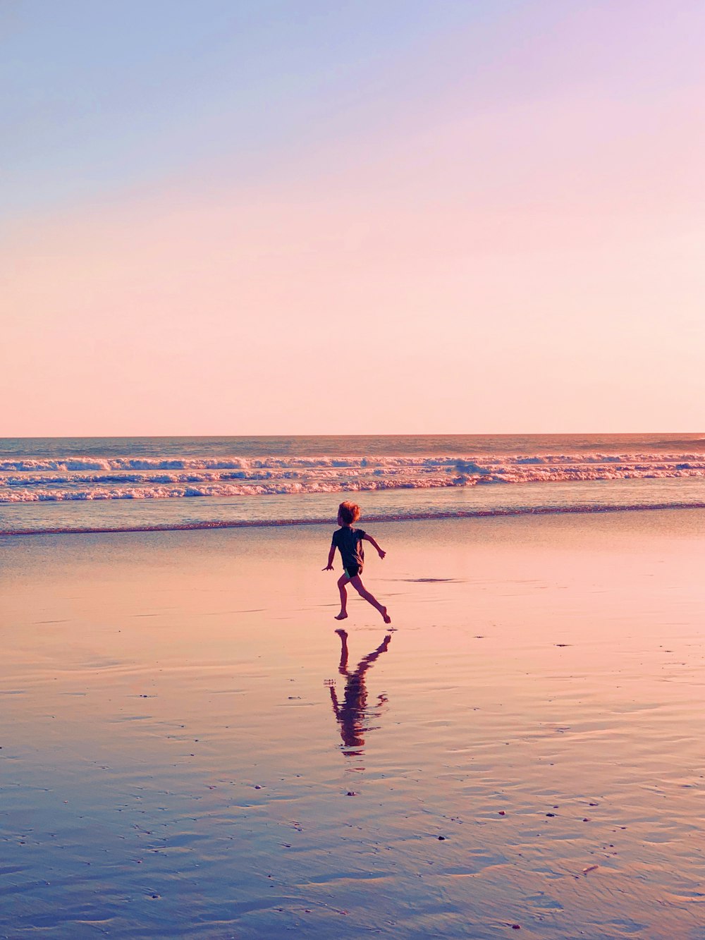 toddler runs on seashore