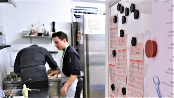 A professional conducting a HACCP training session with restaurant staff.
