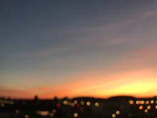 A cinematic video still capturing a golden hour cityscape with smooth motion blur.