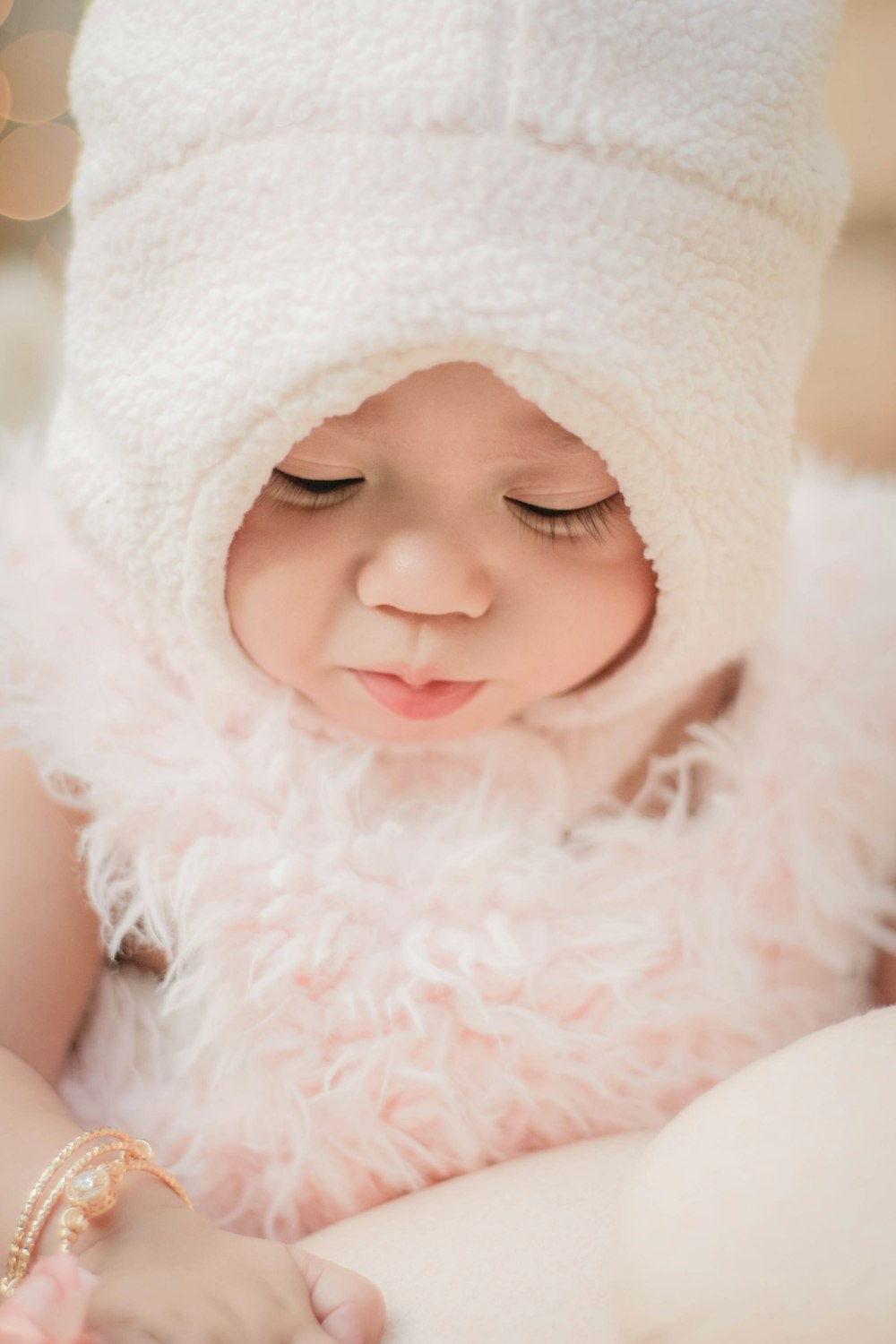 baby wearing white hat