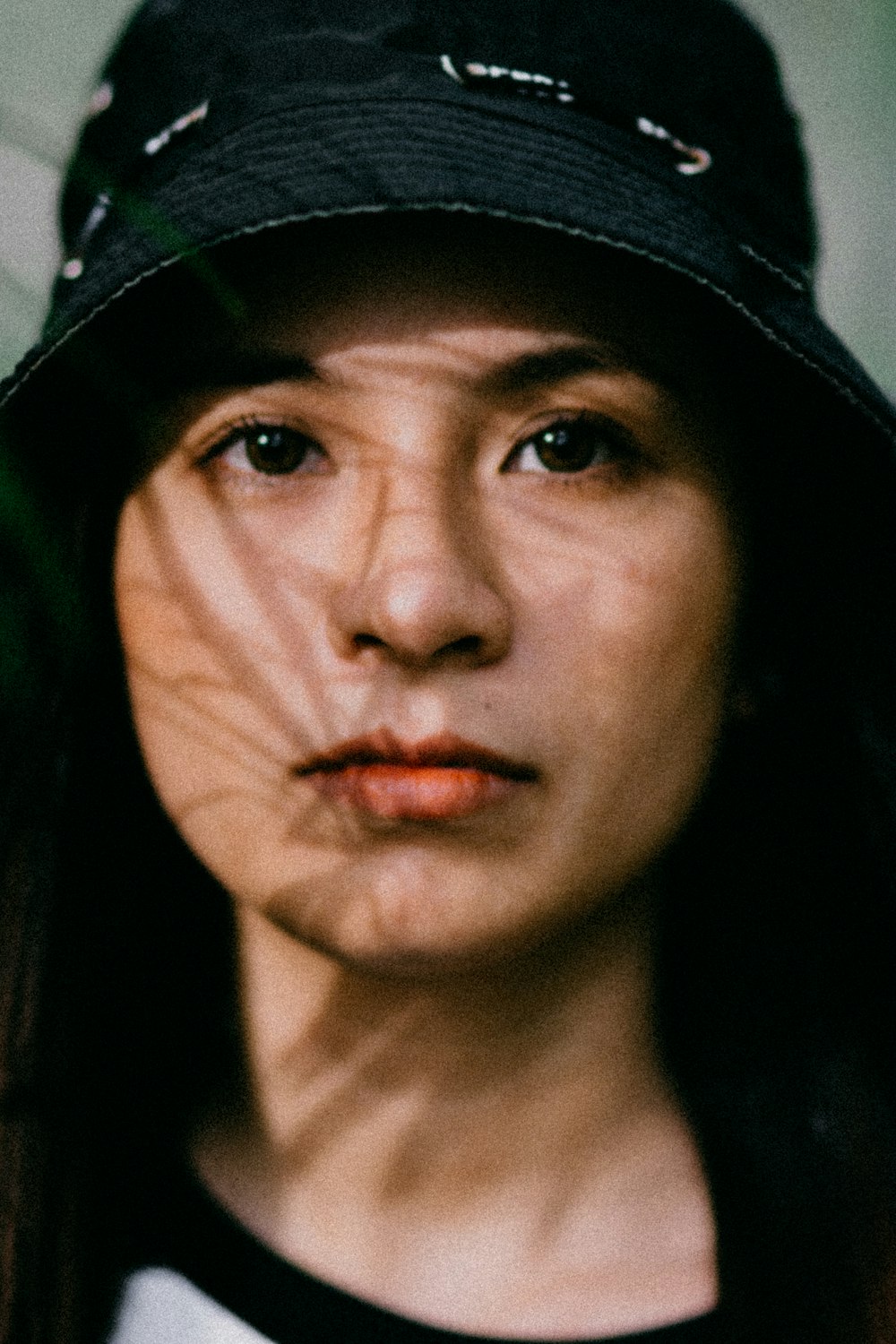 woman wearing black bucket hat