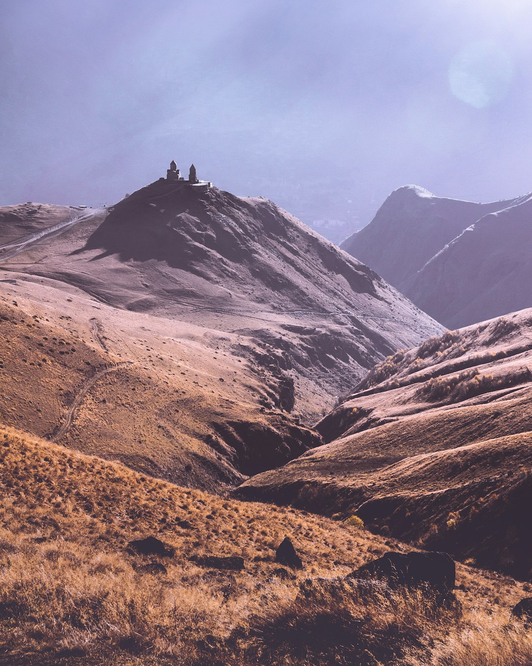 grass and soil mountains during day