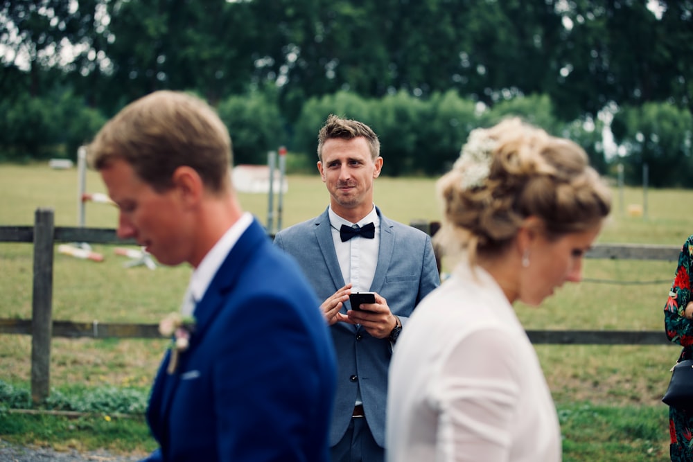 shallow focus photo of man in gray suit jacket