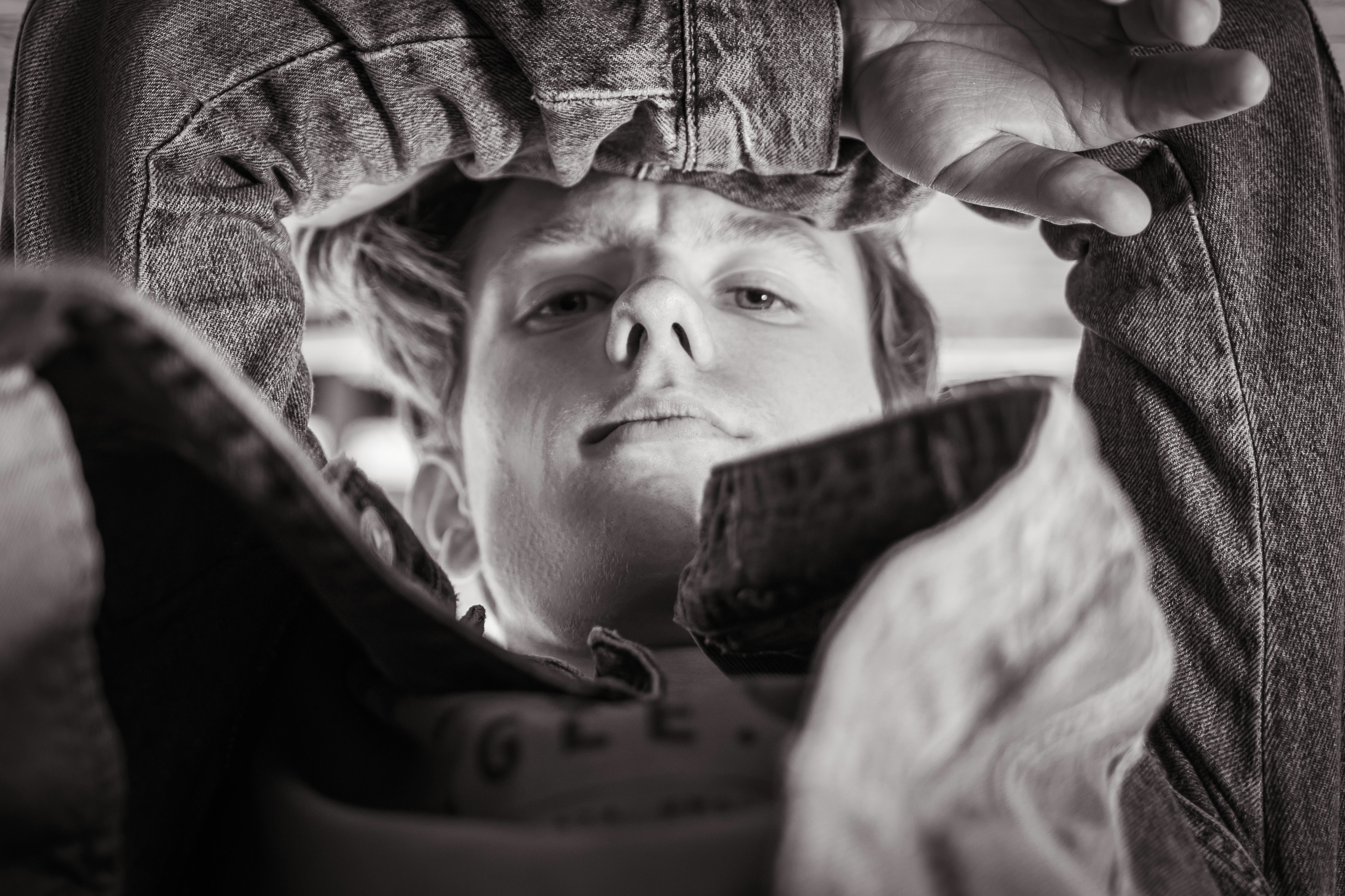 closeup and grayscale photo of man