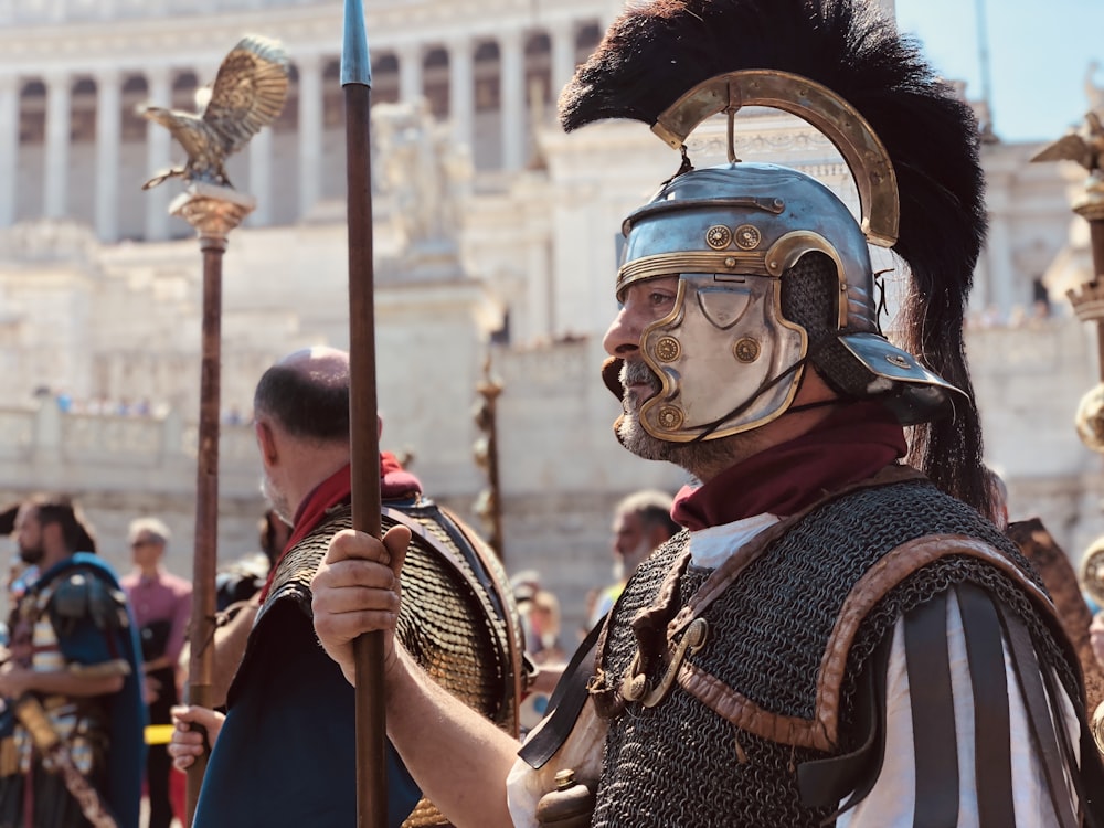 people wearing medieval costumes during day