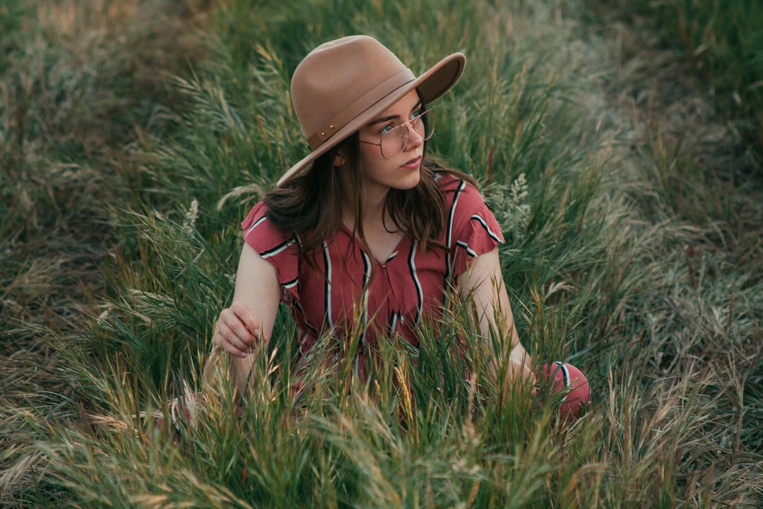 woman sitting on grass smiling