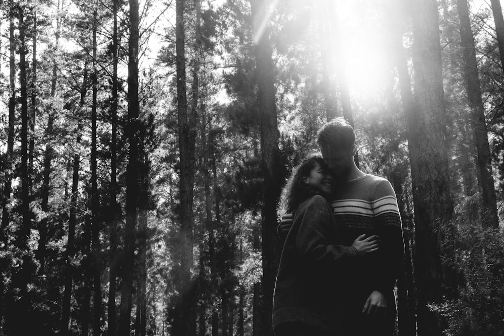 couple beside trees