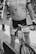 A person wearing a cycling jersey and bib shorts is holding a bicycle. The cycling jersey displays the words 'Mary Free Bed Rehabilitation'. The bicycle has a mounted number 1033. The setting appears to be an event, possibly a race or a group ride.