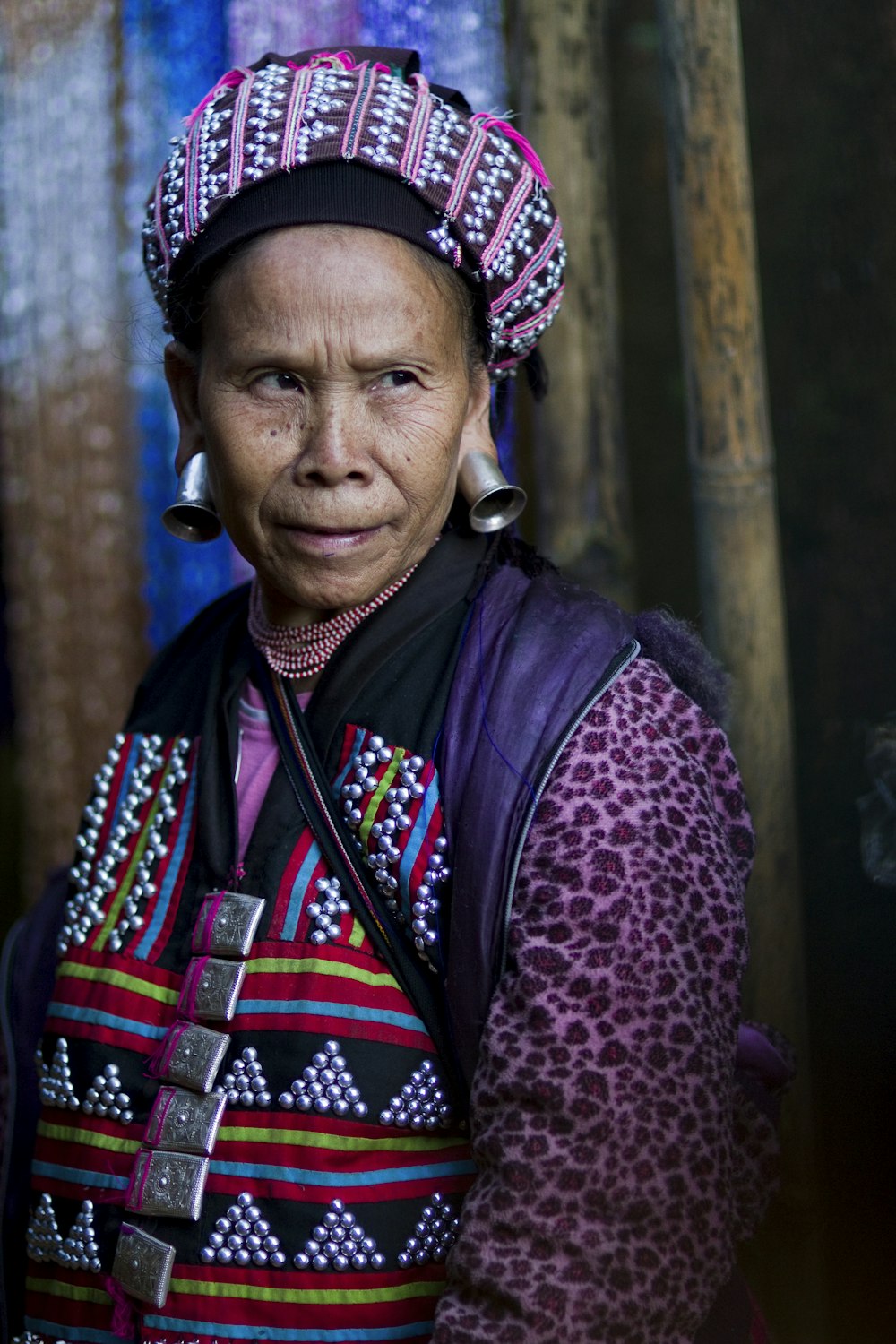 woman wearing purple and multicolored top