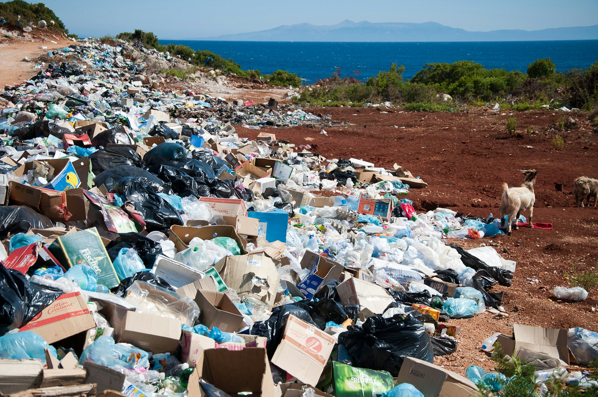 Mountain of rubbish and garbage on the beach by the sea