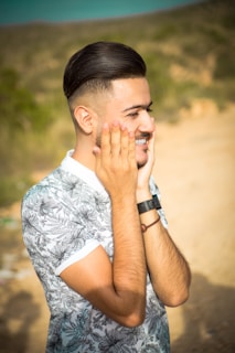 Happy customer smiling while checking the time on a stylish watch outdoors.