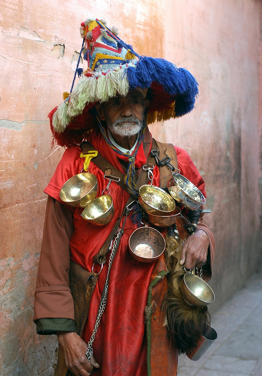 man carrying bowls