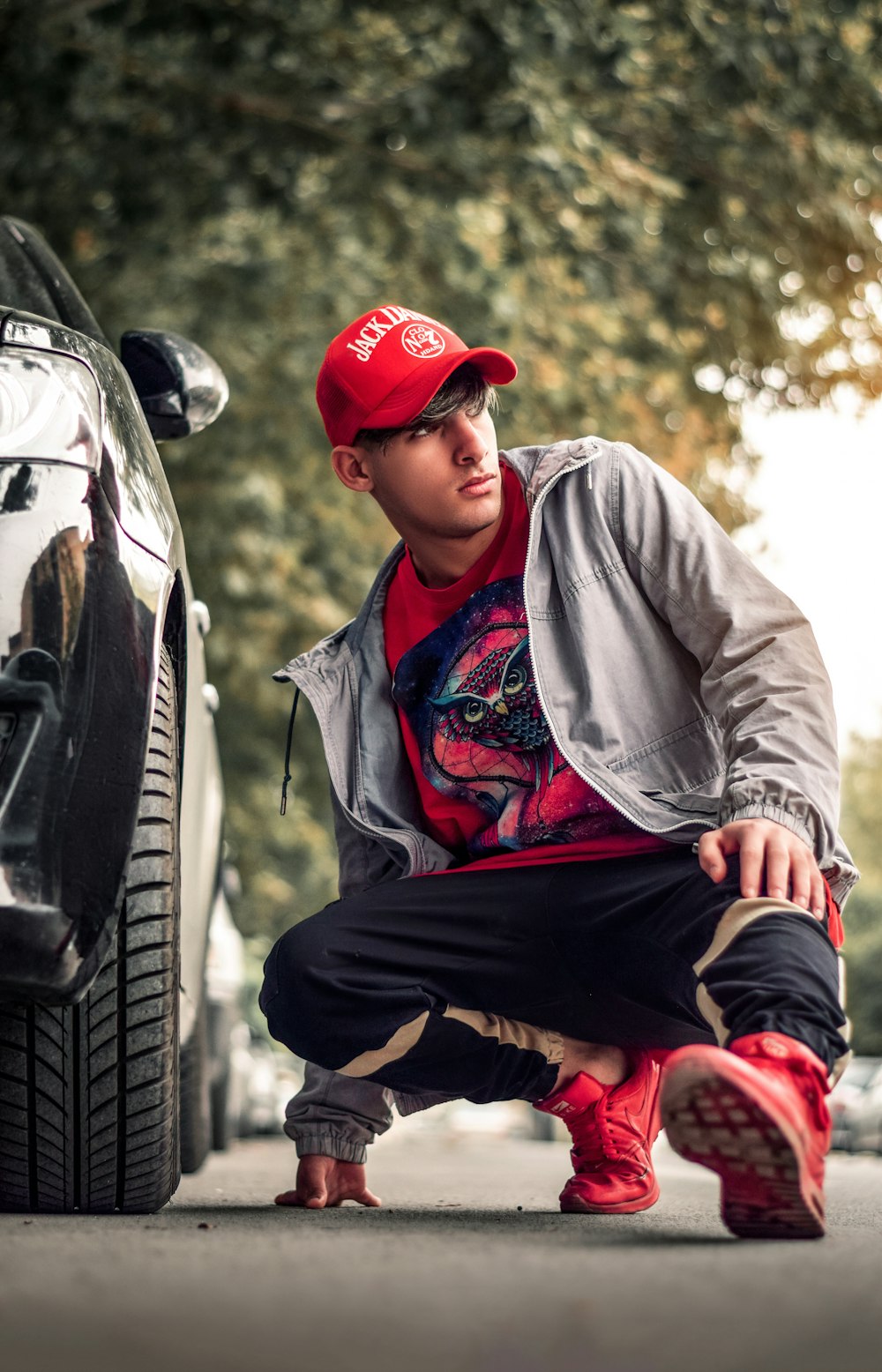 man wearing red fitted cap