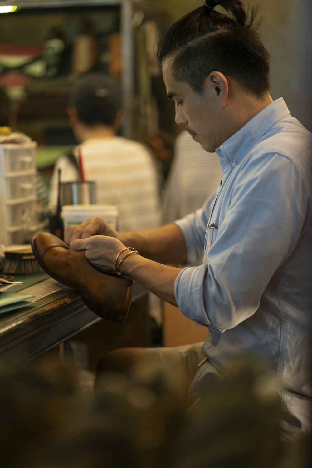 man fixing shoe