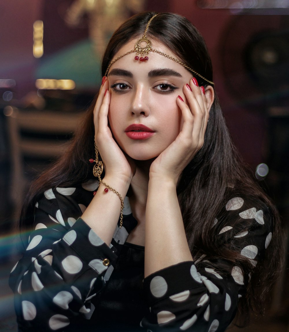 photo-shoot of woman touching her face