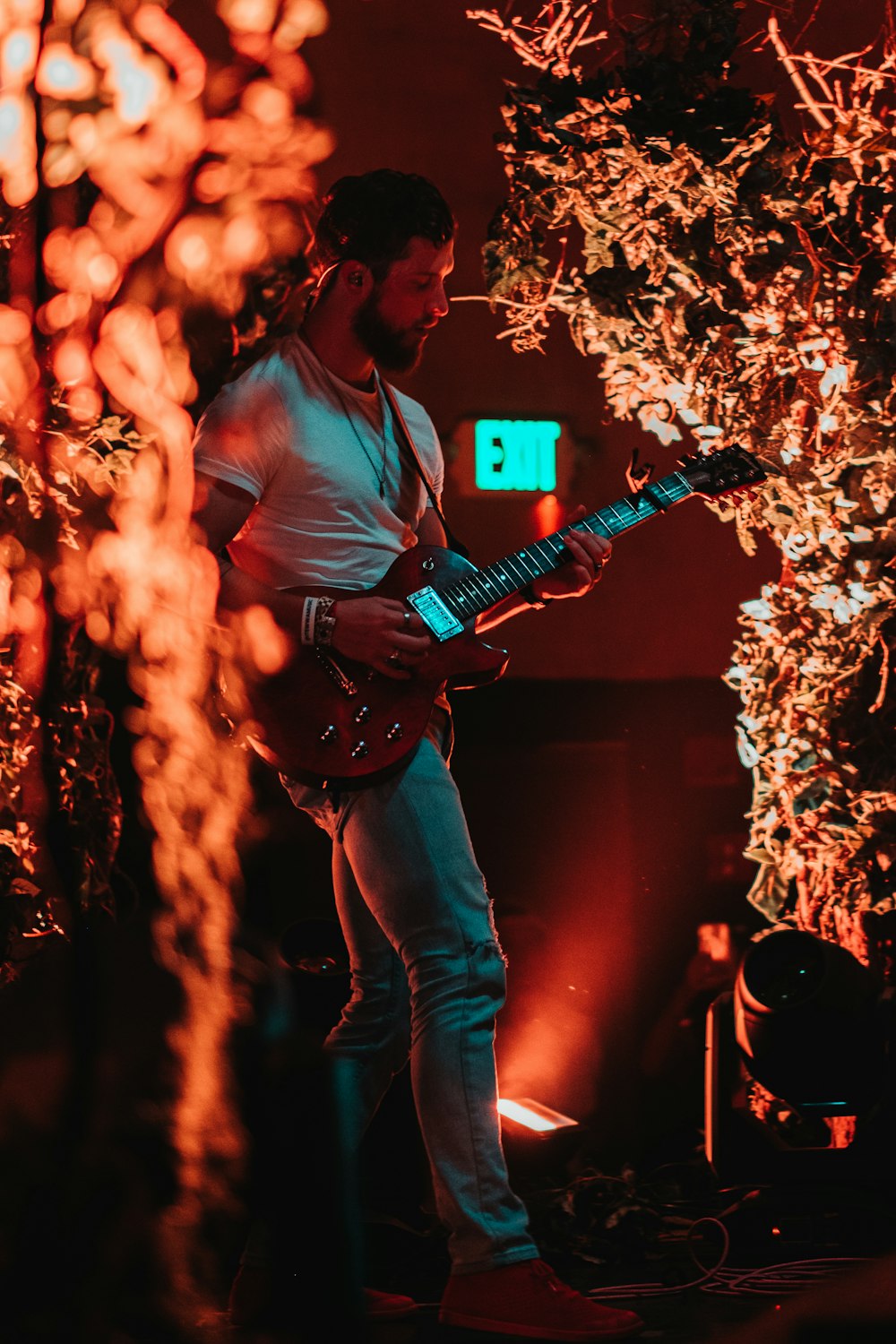 man playing an electric guitar