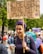 A confident woman holding a 'Fiscal Responsibility' sign at a community event.