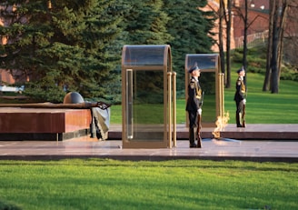 A solemn moment of officers paying tribute at a memorial site honoring fallen comrades.