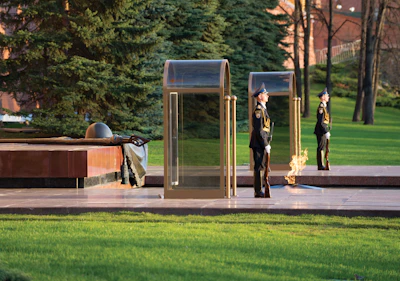 Honor Guard members in uniform standing proudly at a local St. Augustine memorial.