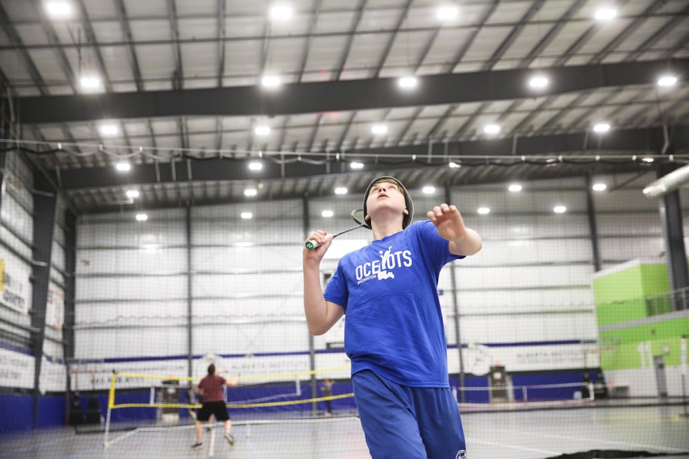 boy playing badminton