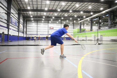 Player smashing a badminton shuttle