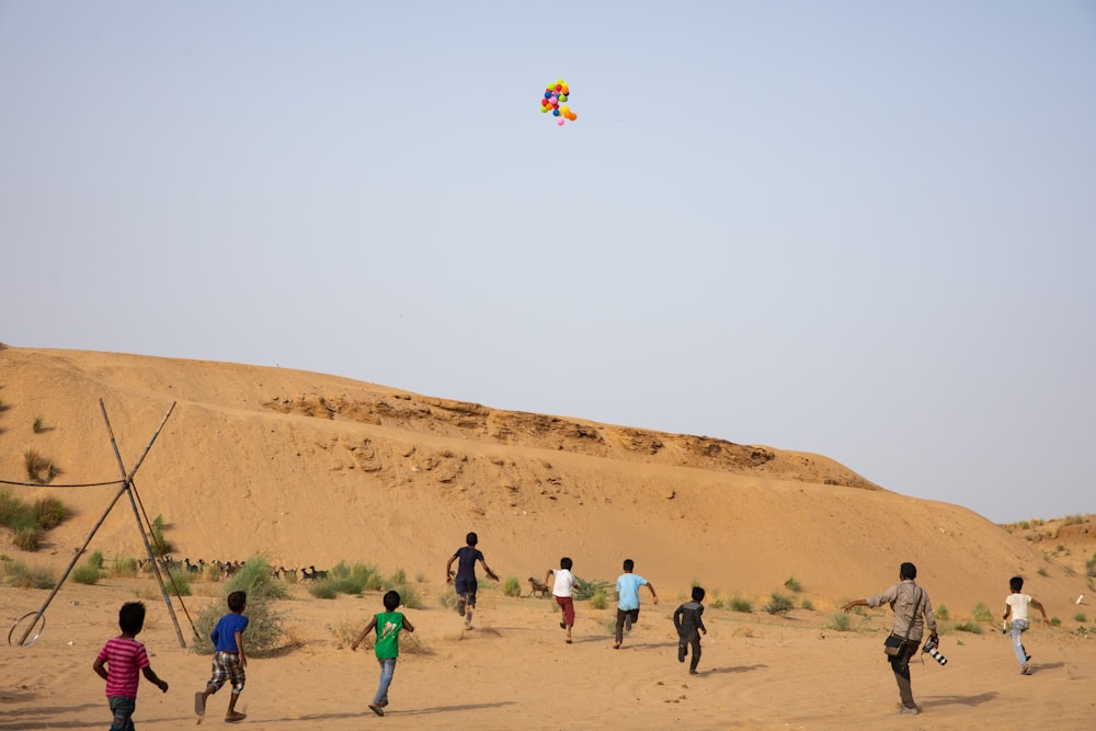 people walking on brown sand during daytime