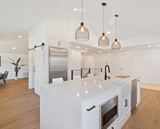 turned on pendant lamps above kitchen island