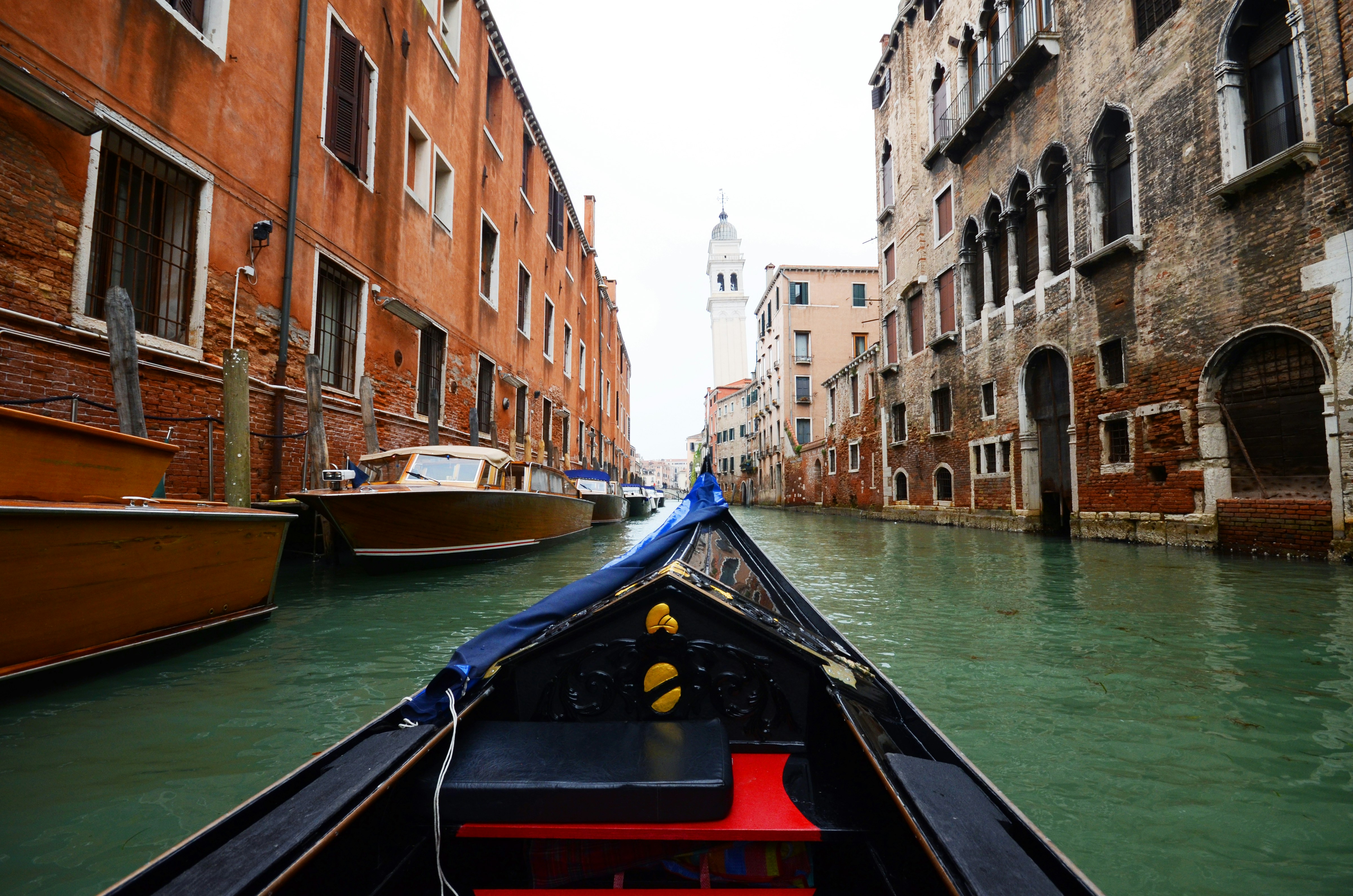 blue canoe on river, Gondola ride in Venice, Italy