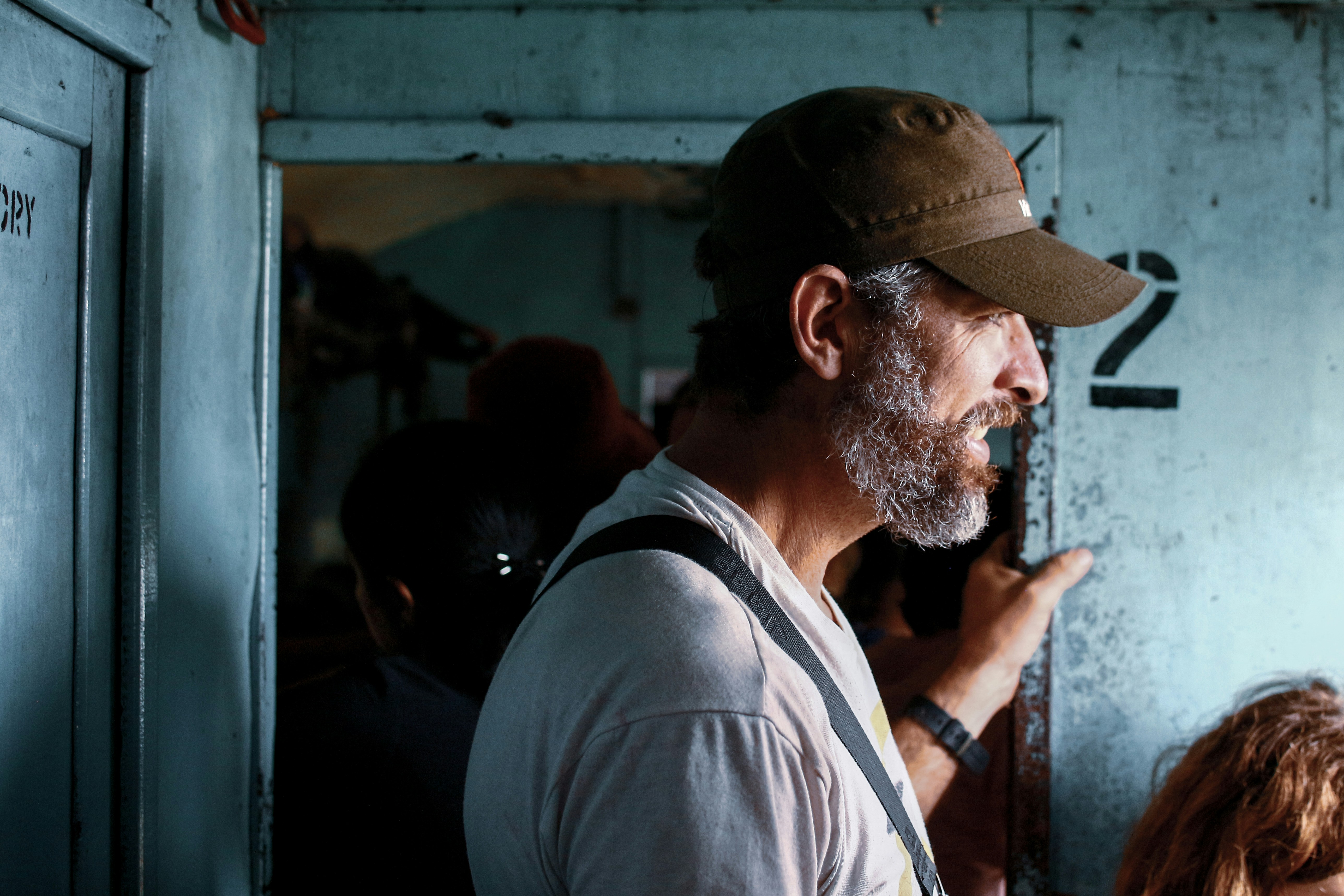 man wearing brown cap