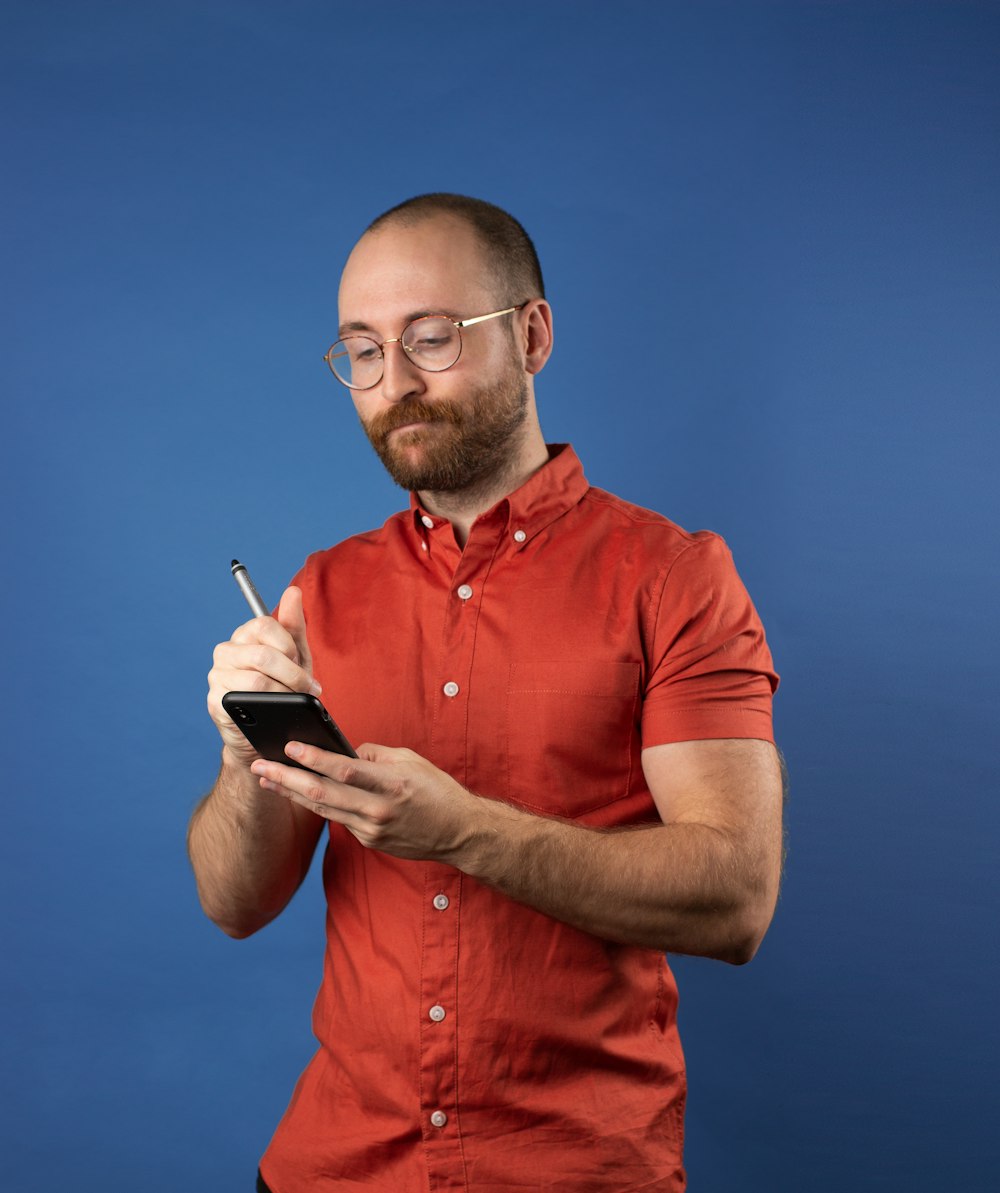 man writing on phone