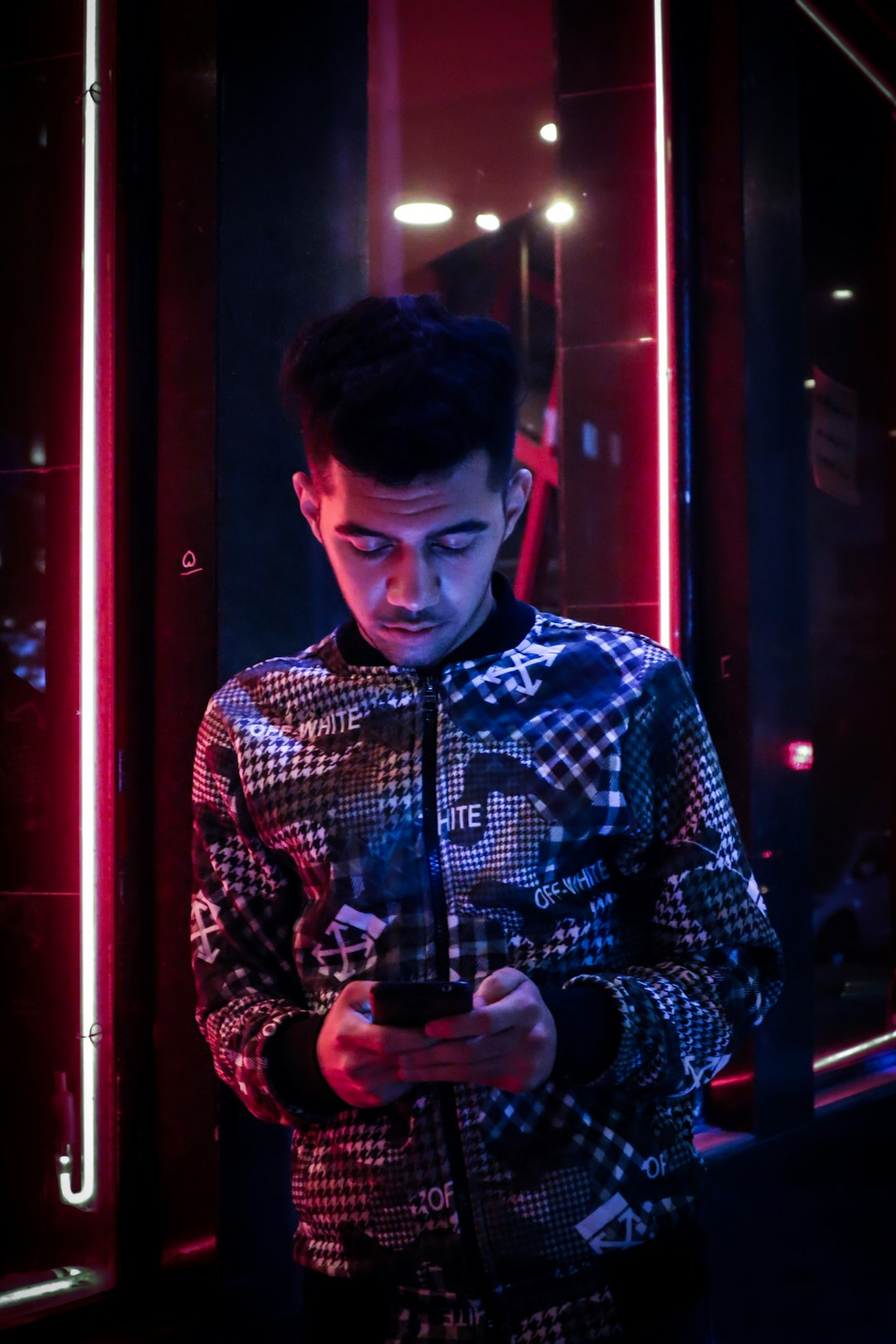 man leaning on wall