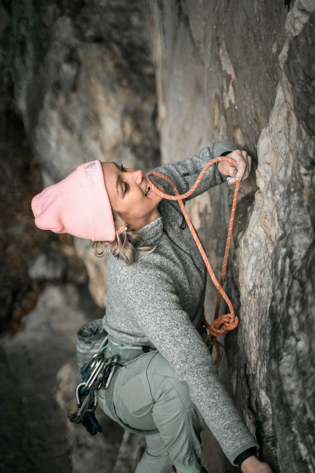 woman doing mountain climbing during daytime