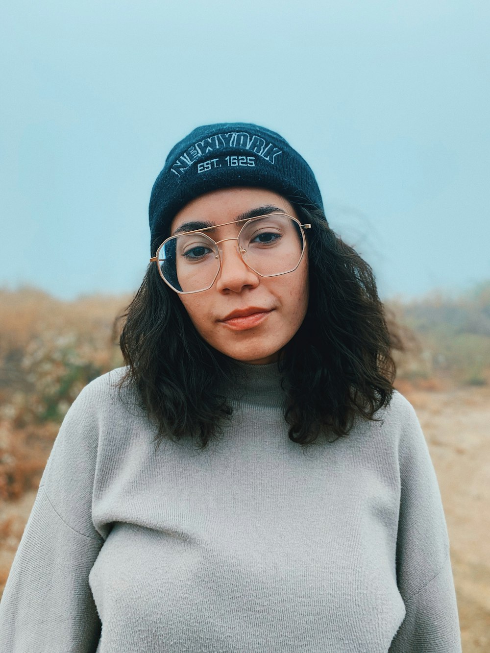 woman in gray sweater