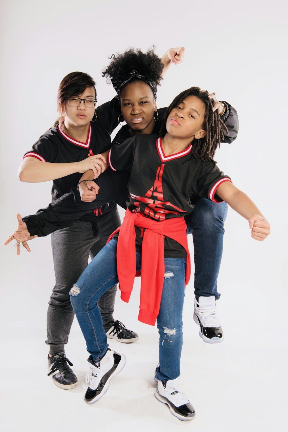 a group of young women standing next to each other