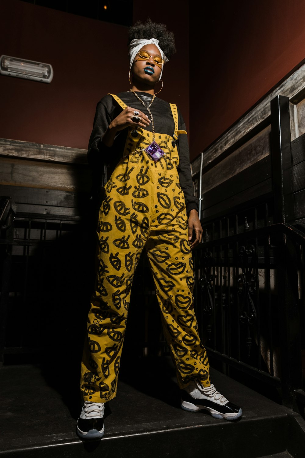 woman wearing yellow overalls