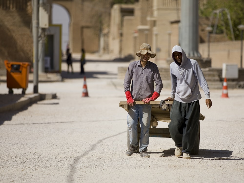 men pulling cart