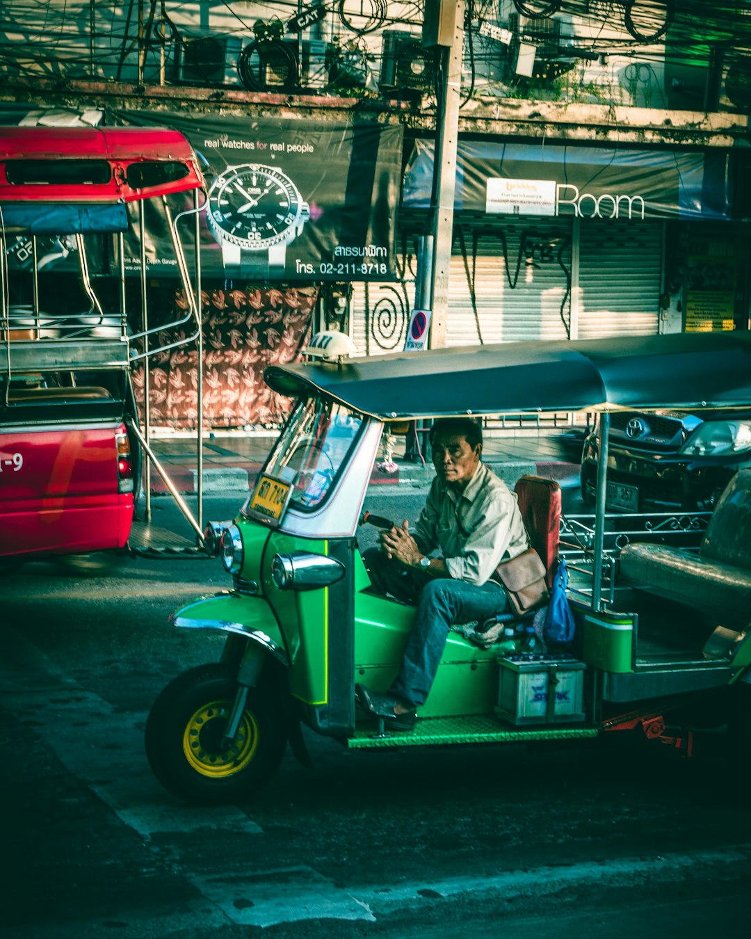 man driving auto rickshaw