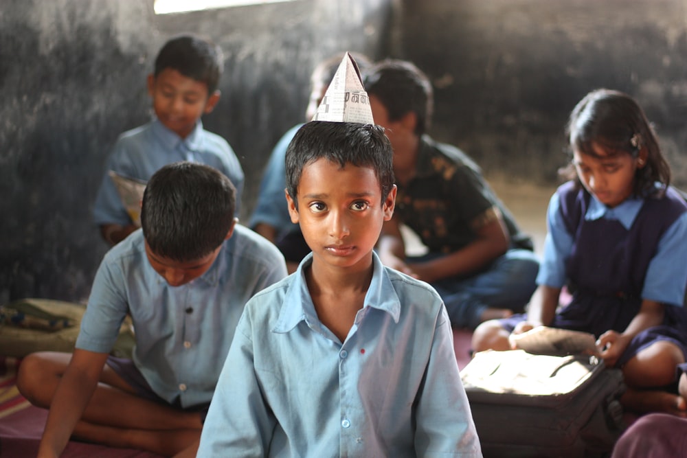 boy wearing blue dress shirt