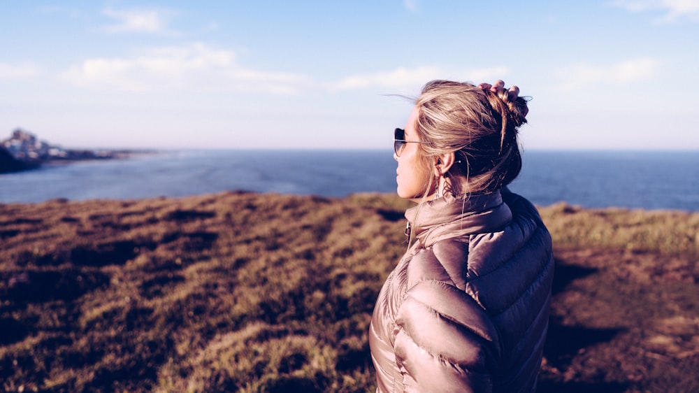 woman standing on cliff