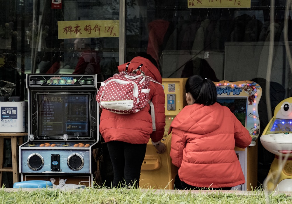 girl's playing on arcade