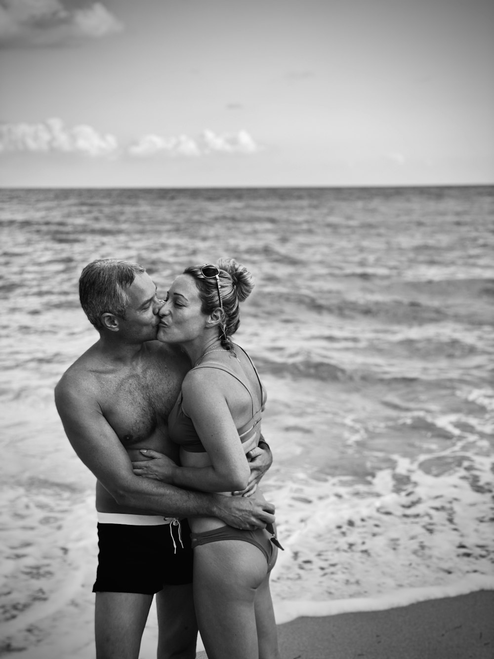 kissing couple on shore