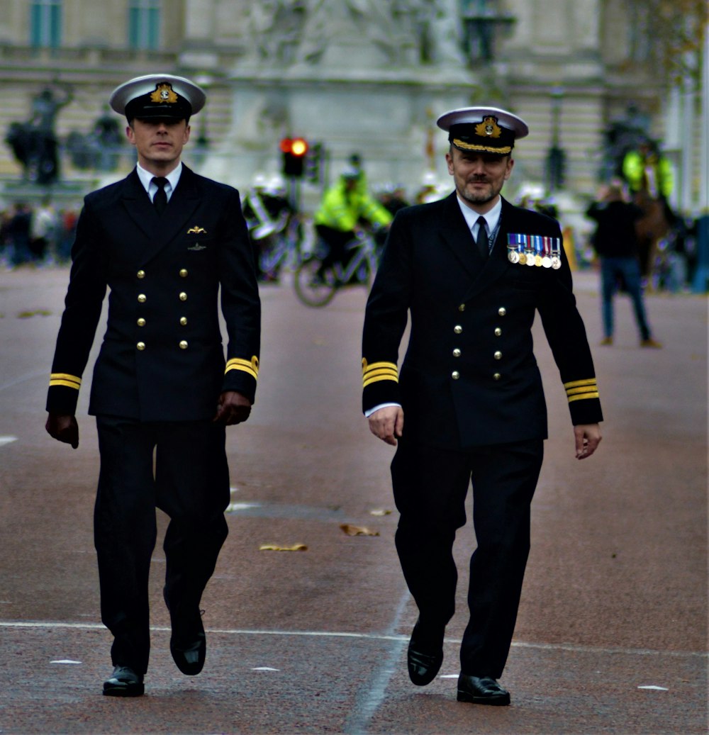 two men in uniform walking side by side