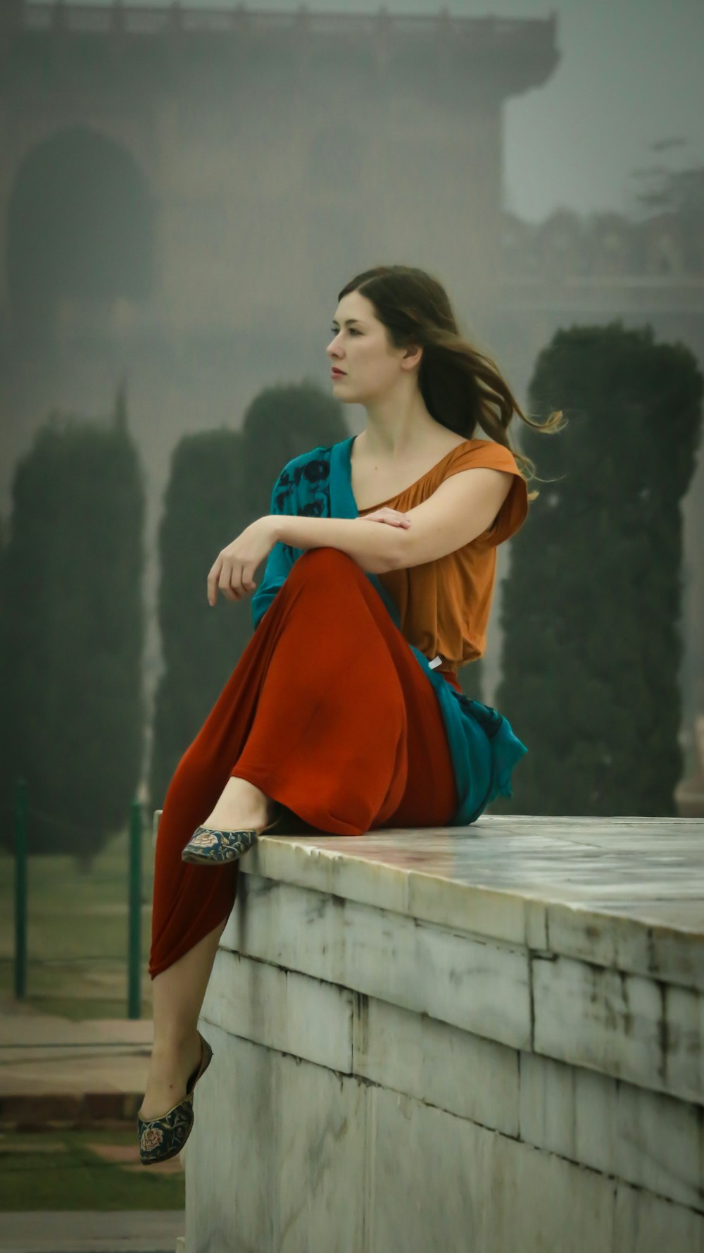 woman sitting on white ground