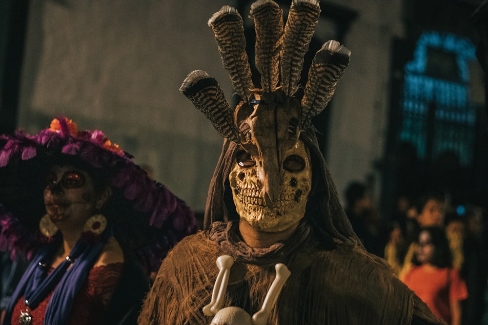 two persons wearing masks