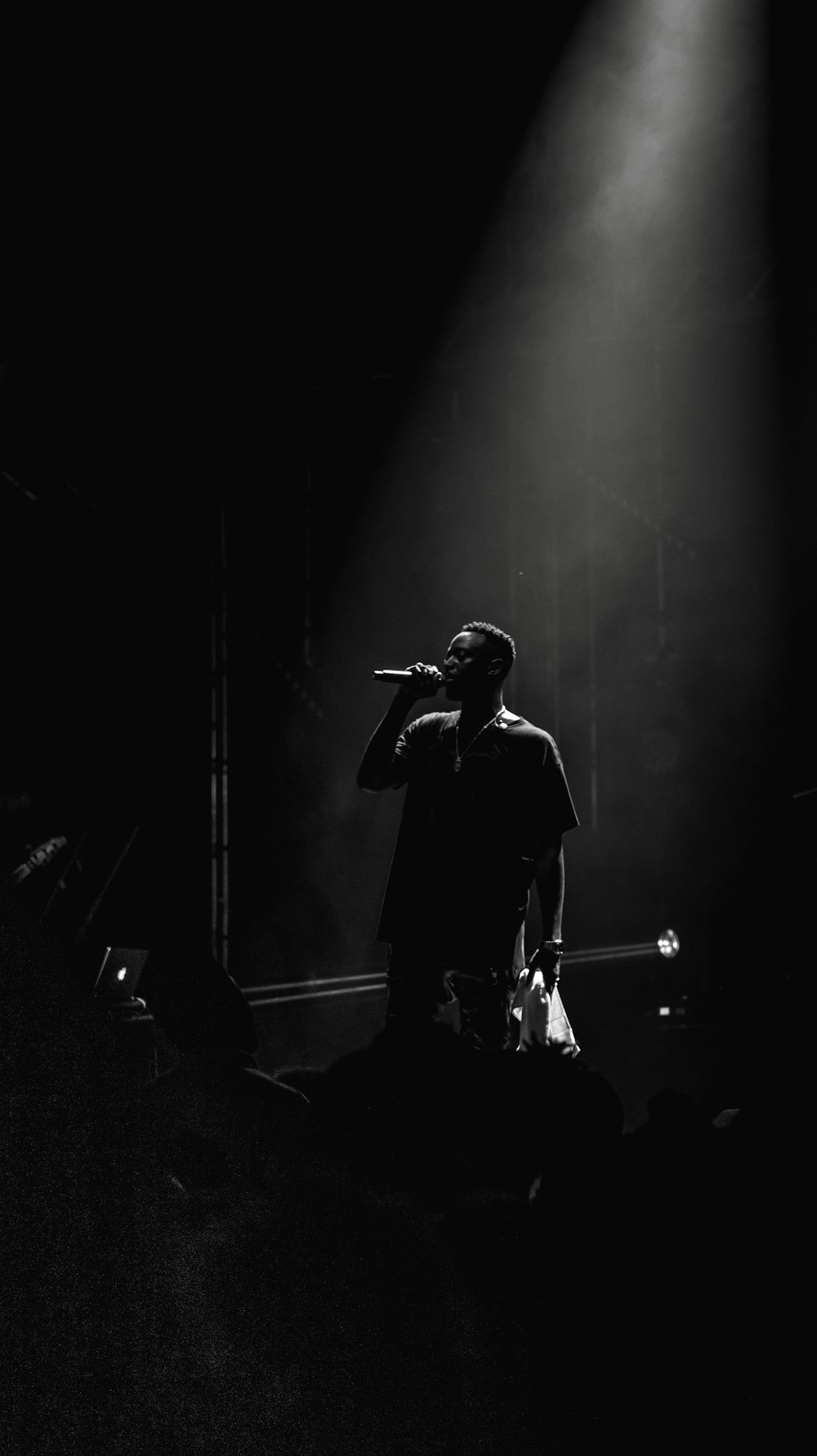 man singing on stage