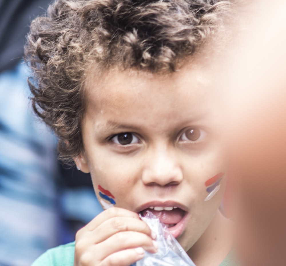 boy holding clear pack